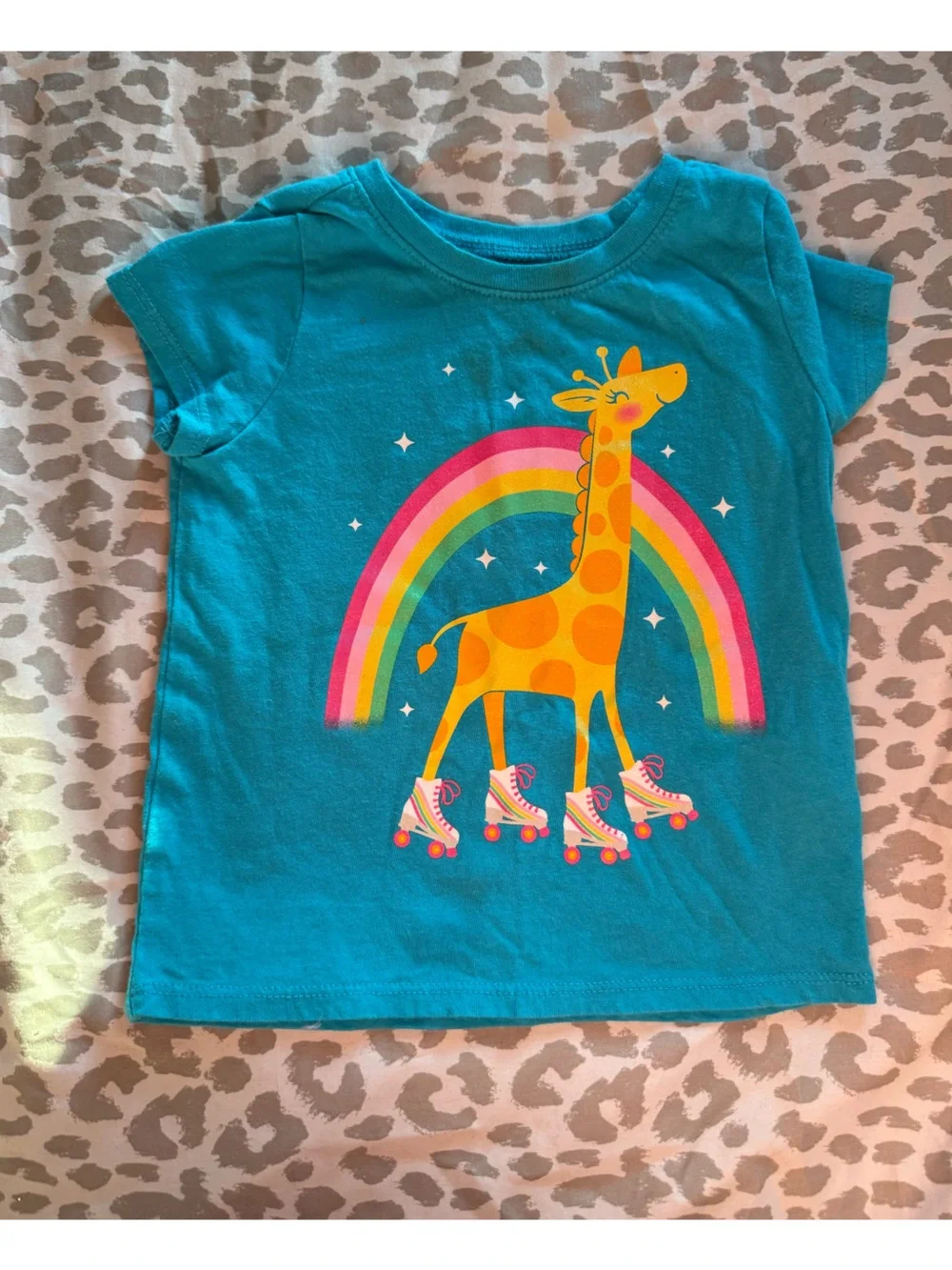 Turquoise Kids Tee with Roller-Skating Giraffe and Rainbow